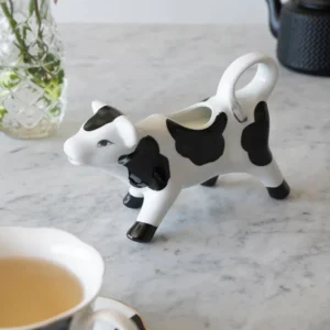 Brocca per il latte con disegno di mucca bianco e nero